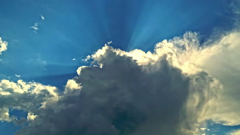 low angle view of dense clouds blocking sunrays