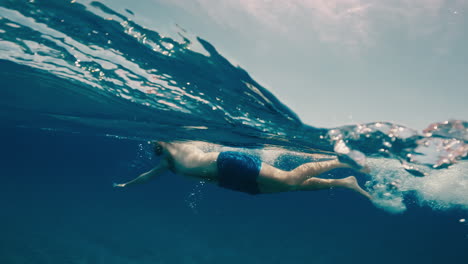 man swim into the sea