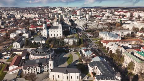 Drone video of Iasi city center showing cathedrals, Ferris wheel, and Ștefan cel Mare Boulevard