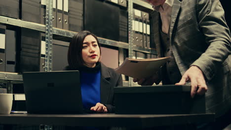 Forensic-team-examining-clues-and-evidence-stored-in-a-case-box