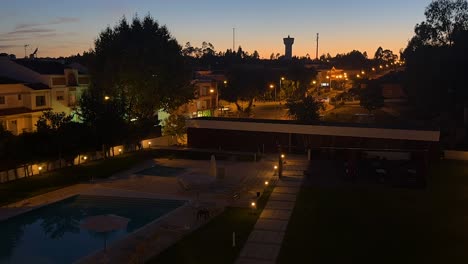 Time-lapse-and-zoom-in-at-night-in-Lisbon,-Portugal-hotel-after-sunset