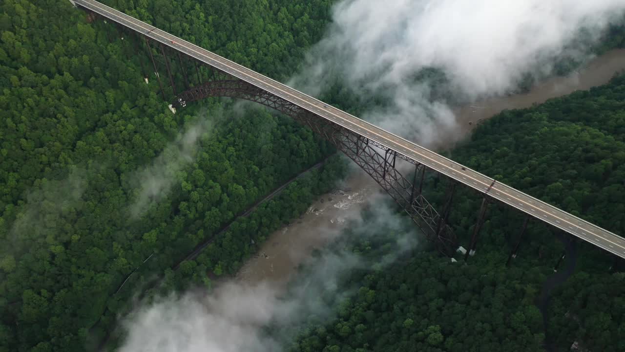 Aerial View of Traffic on New River Gorge Bridge Traffic and Interstate Roadway Abova For and Canyon, West Virginia USA. Drone Shot