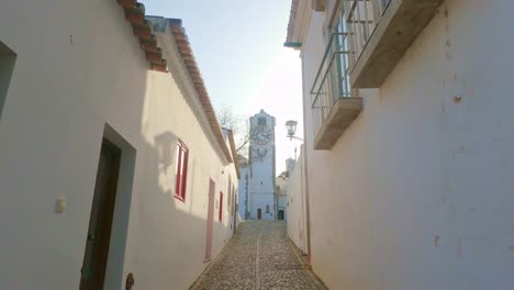 narrow laneway to santa maria church tavira algarve, old historic streets and laneways at sundown on a warm spring evening