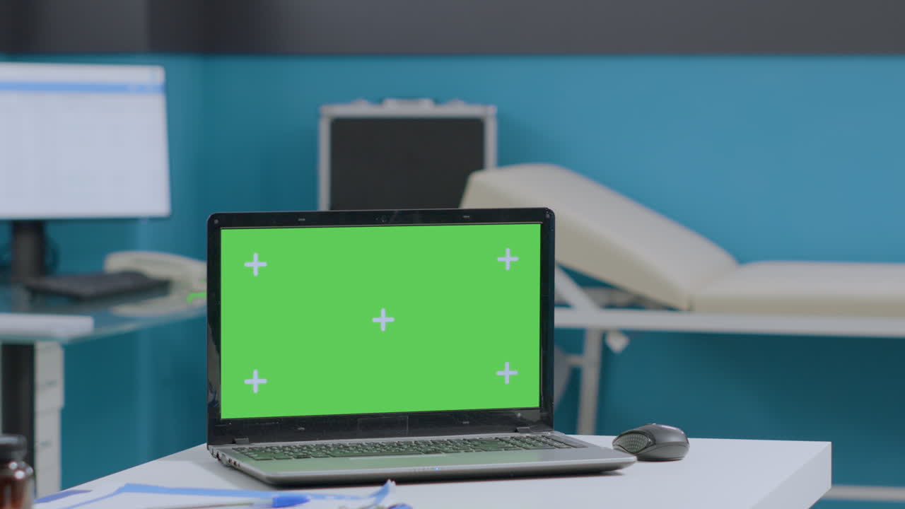 Laptop with green screen in medical office