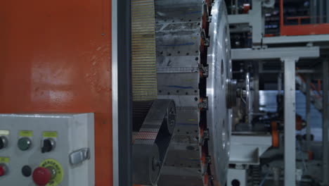 robotic tyre production equipment working at modern automotive warehouse closeup