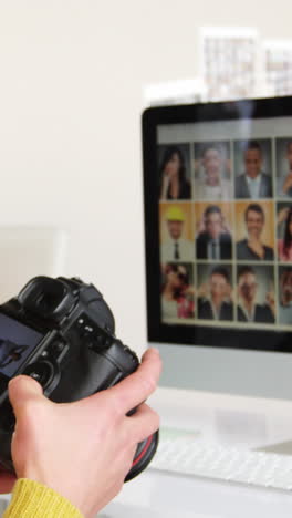 photographer looking at photos on digital camera