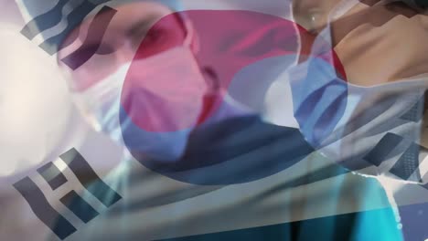 animation of flag of south korea waving over surgeons in operating theatre