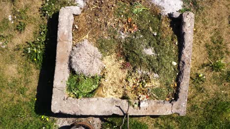 Compost-bin-in-the-garden,-aerial-view