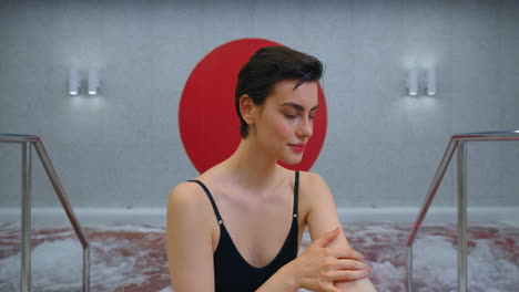 woman relaxing in a modern spa hot tub