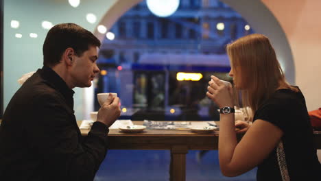 Friends-in-cafe-talking-and-having-tea