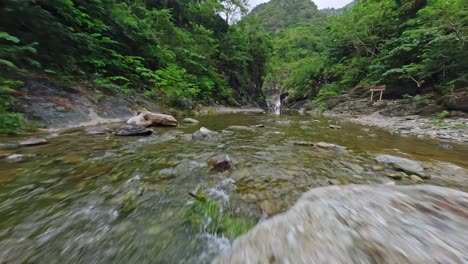 fpv shot over the river in las yayitas, bani, dominican republic