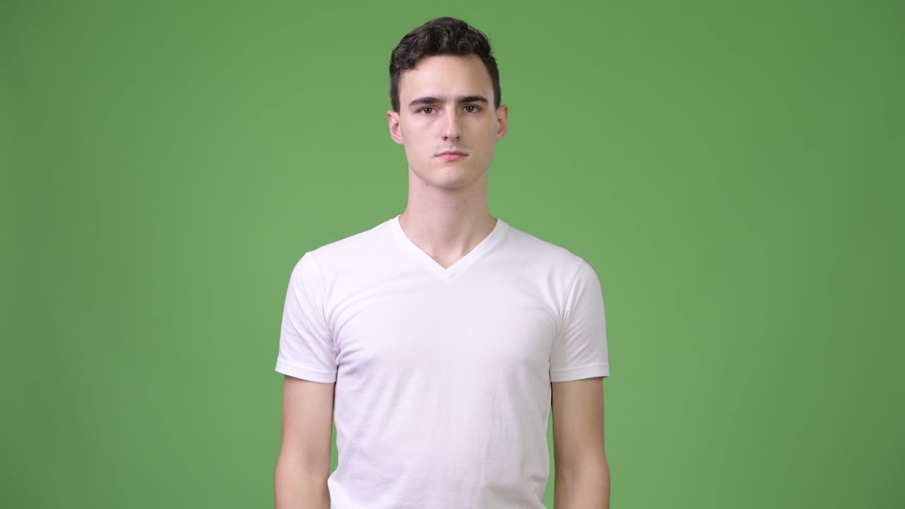 Young handsome man covering eyes as three wise monkeys concept