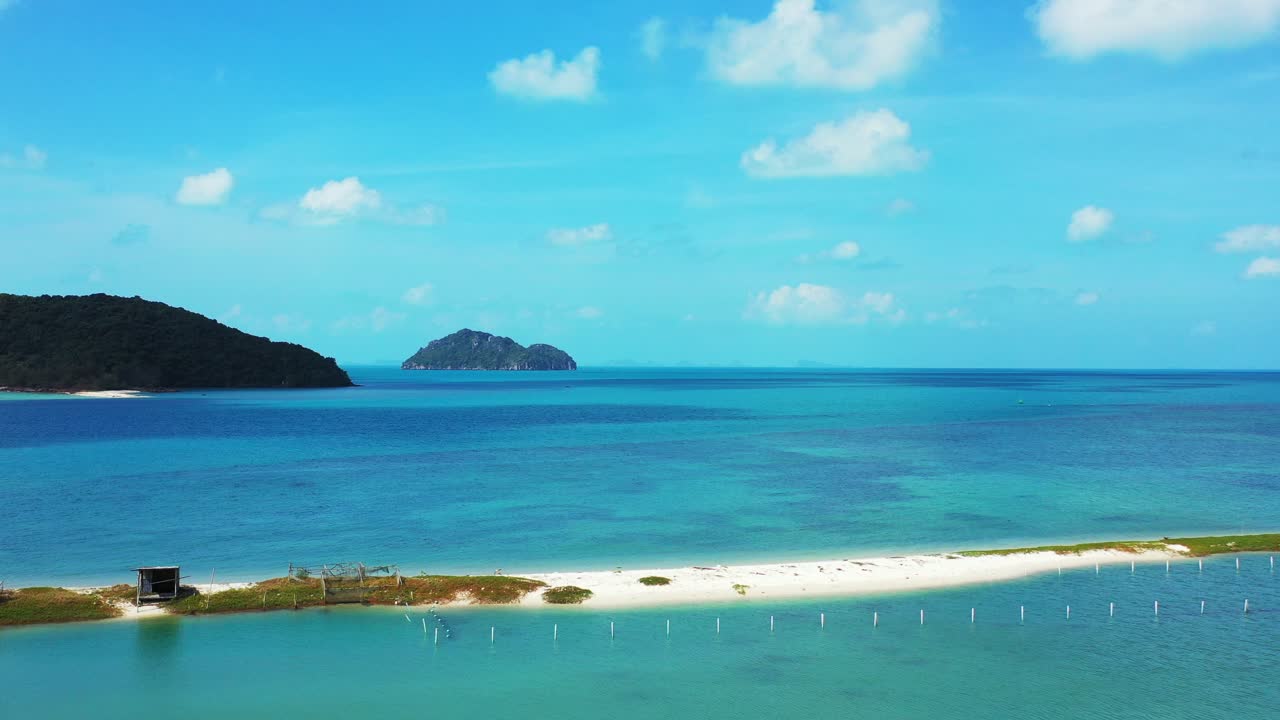 Small sandbank beach Ao Nai Wok, Koh Phangan. Thailand. Koh Tao and Ko tae Nai islands in the background