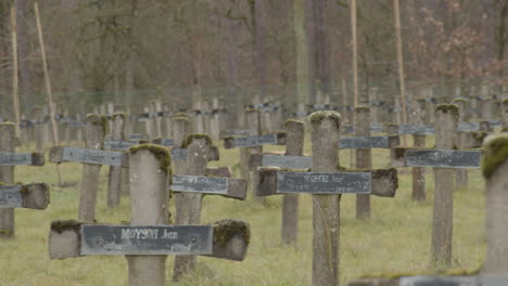 pan over old and broken gravestones at cemetery