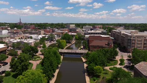 drone descends to reveal dupage river in downtown naperville, illinois