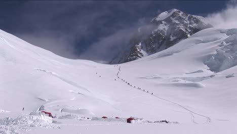 line of climbers above camp