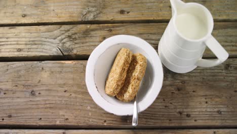 granola bar in bowl with milk jug 4k