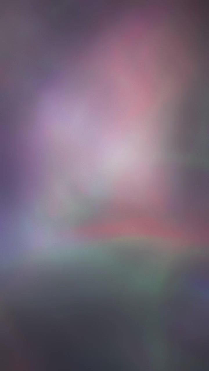 Colorful wavy lights flowing in an abstract pattern. Vertical background.