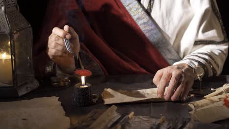 Melting-sealing-wax-in-ancient-times.