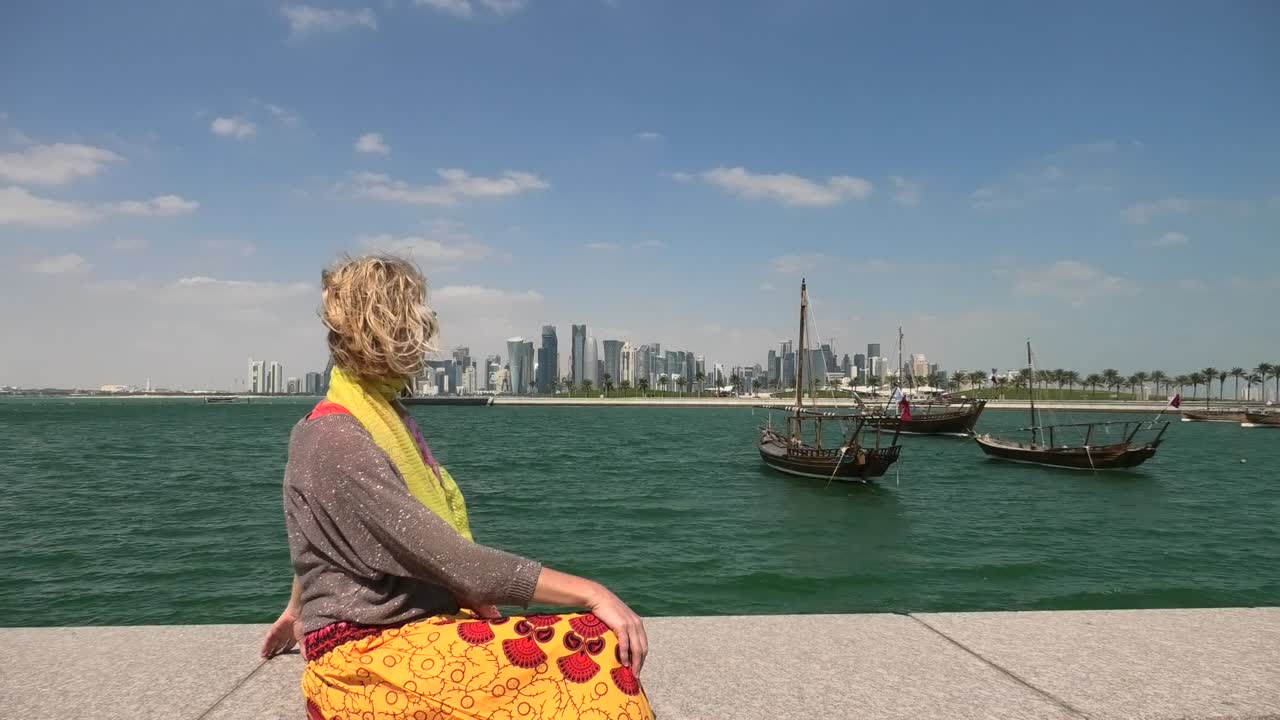 Doha seafront happy woman