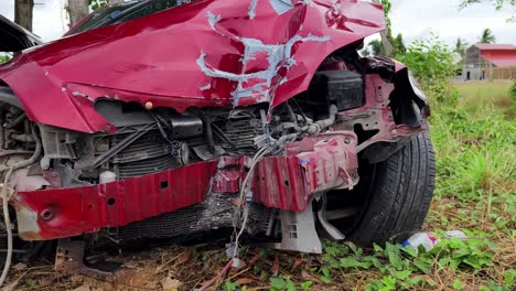 damaged red car