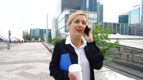 businesswoman walking in financial district