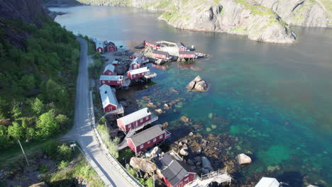 nusfjord: picturesque houses and fishing pier from the air in spring, lofoten islands, norway