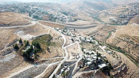 aerial footage over east jerusalem palestinian neighborhoods with security fence