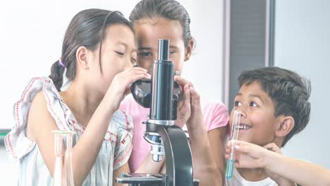 animation of a group of happy schoolchildren using microscope in science class