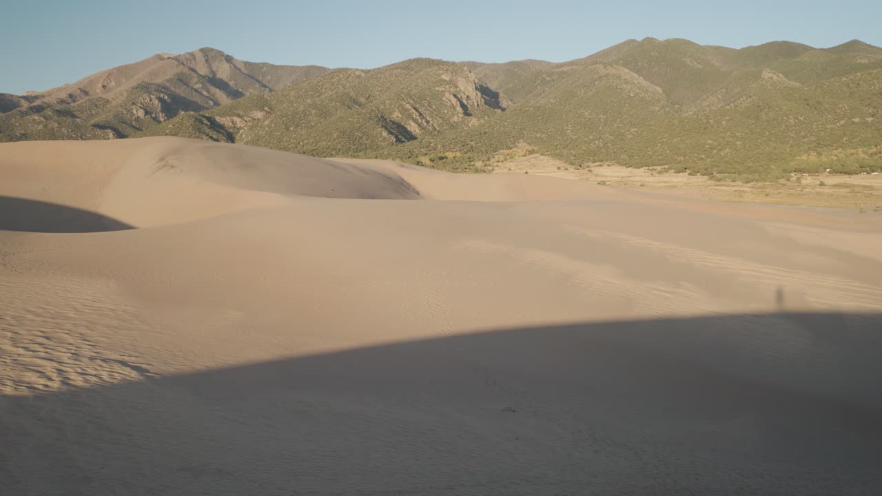 Sand Dunes and Mountains Landscape