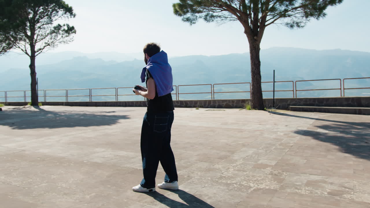 Man taking pictures of mountains
