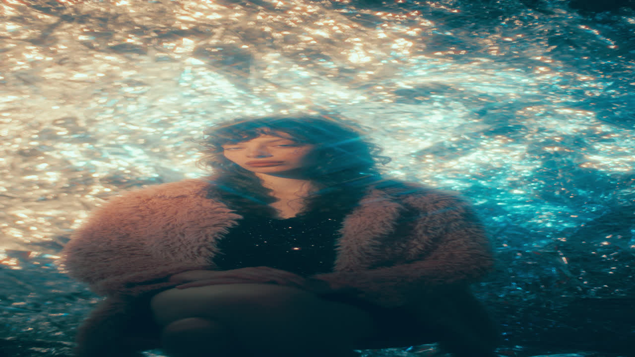 Portrait of Stylish Woman in Fur Jacket against Shimmering Background
