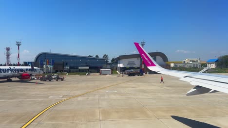plane window view takeoff suceava airport in romania, fly airplane wing view