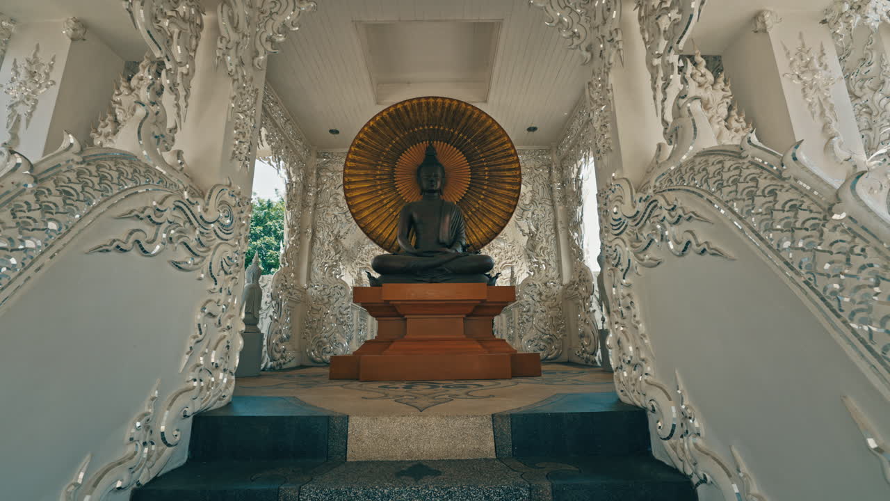 Intricate Buddha Statue at a White Temple