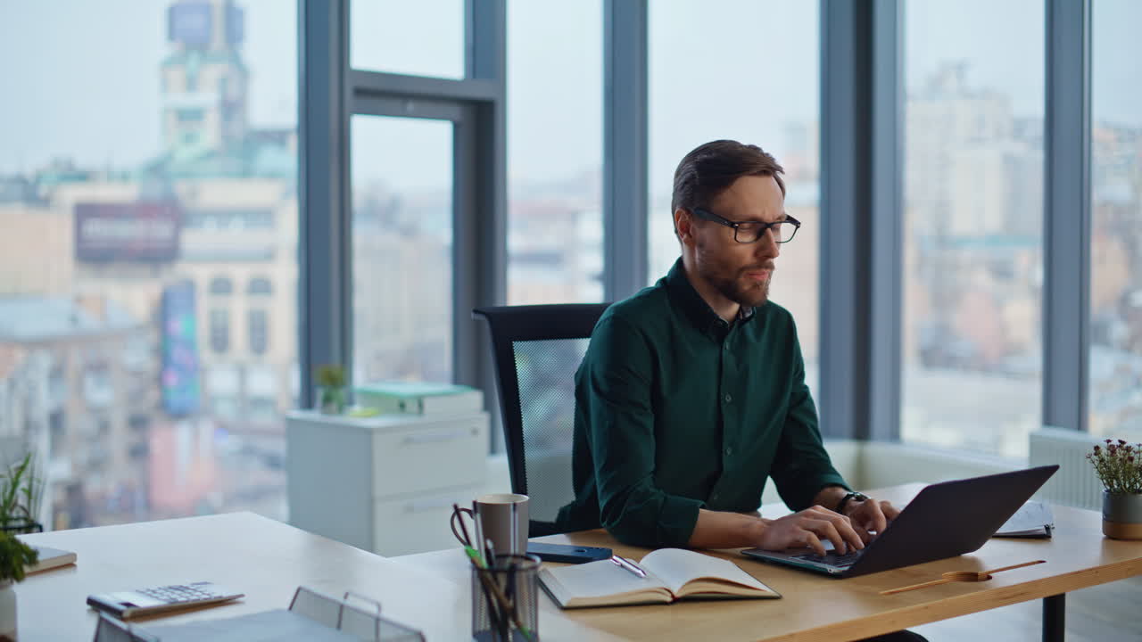 Professional startuper planning strategy typing computer at luxury office
