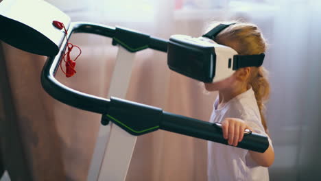 blonde girl with vr headset works out on treadmill in room