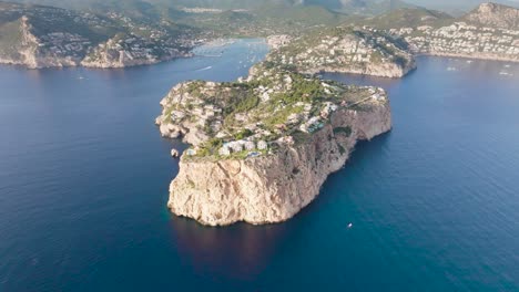 Aerial-view-of-scattered-island-with-infrastructure-near-turquoise-water-bay