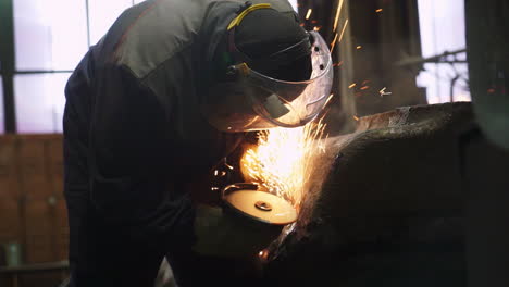 metalworker grinding metal