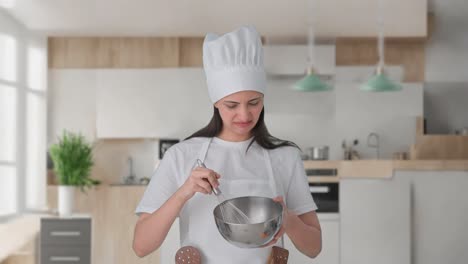 indian female professional chef making food