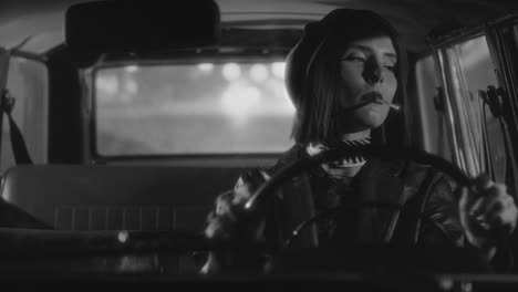 beautiful woman smoking cigarette while driving retro car at night