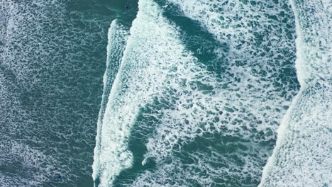 Drone-shot-of-ocean-waves-crashing-on-the-beach-in-British-Columbia-Canada