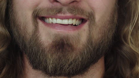 close-up-young-man-mouth-smiling-happy-caucasian-male-with-beard-lower-face-long-hair