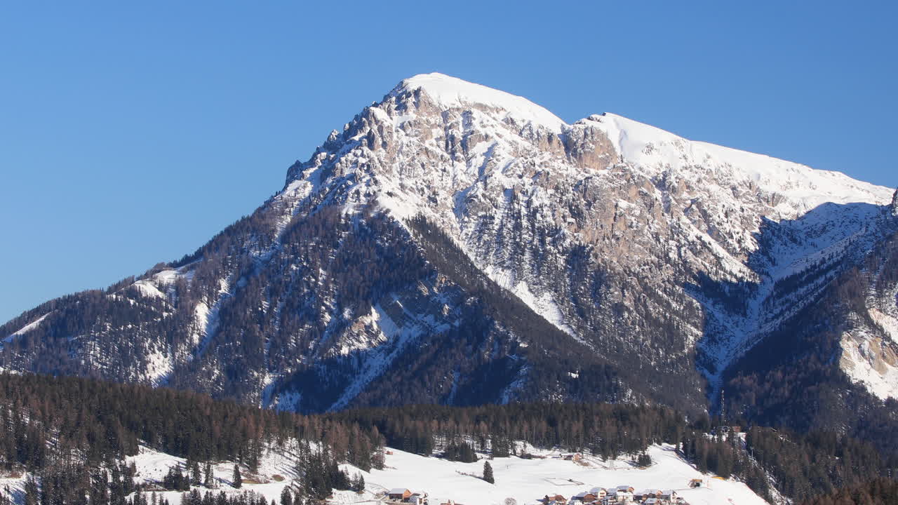 Cold winter snow and blue skies over the Dolomites in northern Italy.