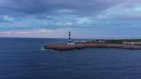 Aerial-pull-back-reveal-of-Menorca,-Spain-Artrutx-Lighthouse