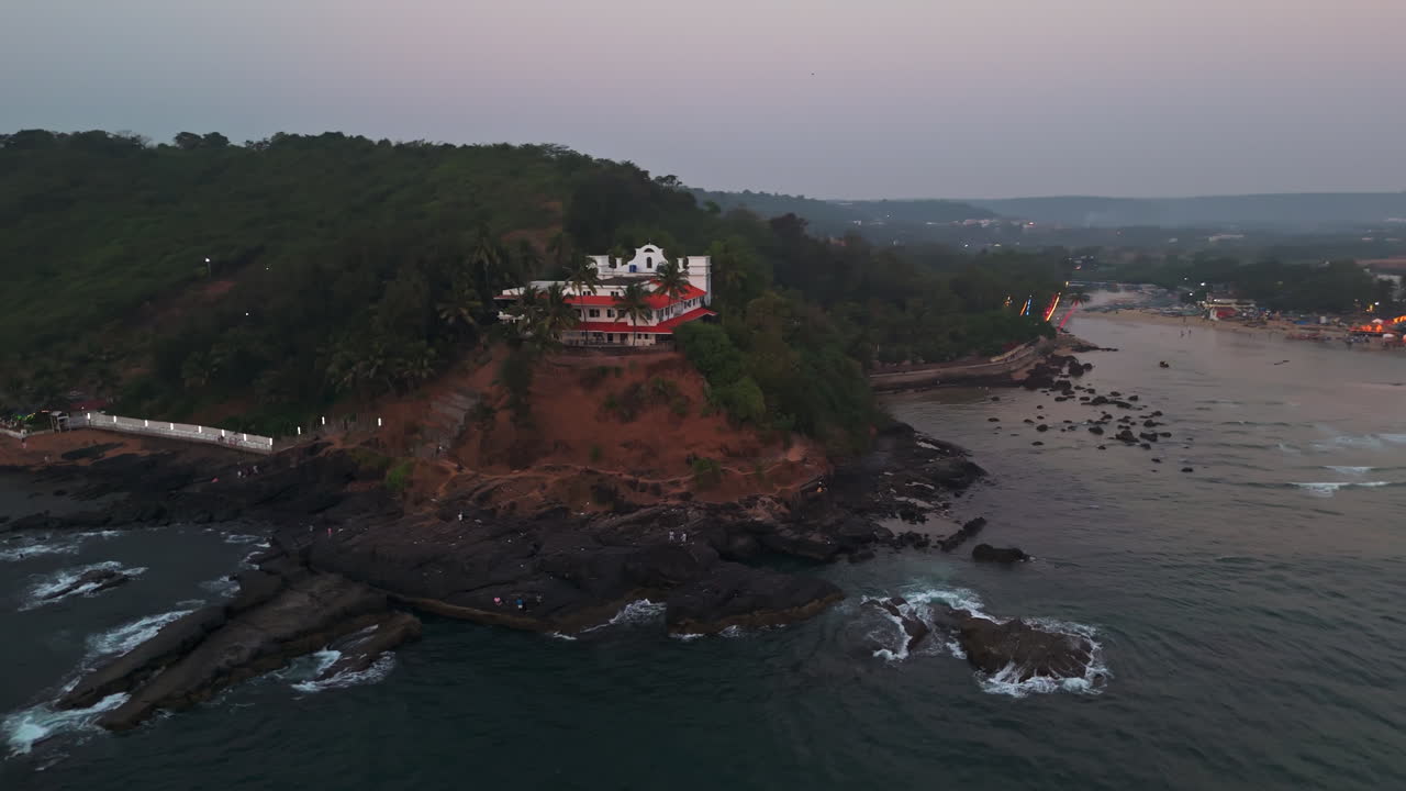 Aerial view rising around the Baga viewing point, vibrant evening in Goa, India