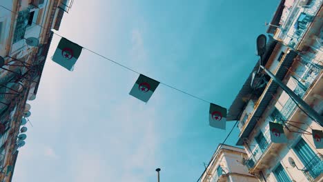 small flag of algeria as a pennant in an alley in the city of algiers