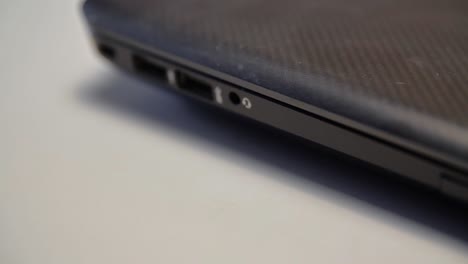 connecting a cable to a laptop