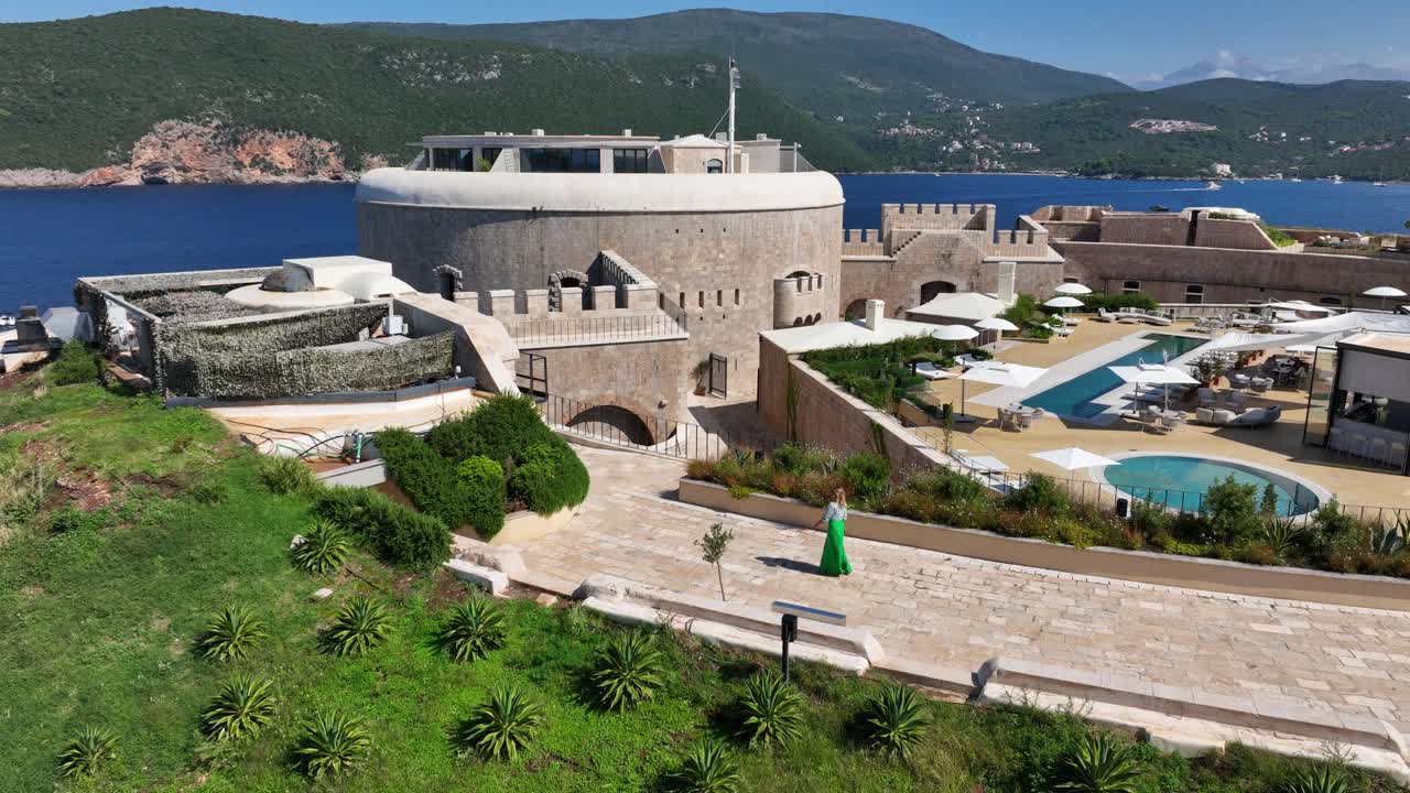 Luxury island fort resort with ocean view, poolside vibe, and scenic calm feeling