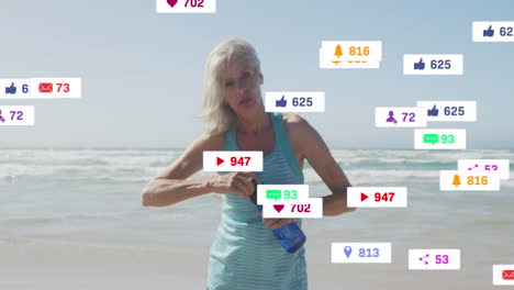 animation of social media notifications, over woman drinking water on beach