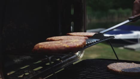 Cooking-And-Grilling-Burger-Patties-On-Griller